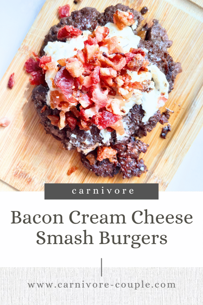 smash burger with bacon cream cheese sitting on a cutting board